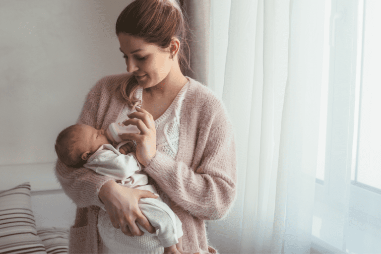 mom bottle feeding baby